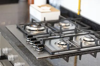 a stove top with four burners on a counter at Stylish Studio Business Bay Near Dubai Mall in Dubai