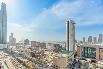 an aerial view of a city with tall buildings at RH- Marina Living- Chic Ocean Heights 3BR with Panoramic Views in Dubai