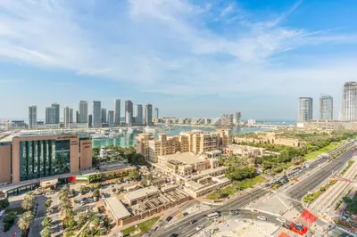an aerial view of a city with tall buildings at RH- Marina Living- Chic Ocean Heights 3BR with Panoramic Views in Dubai