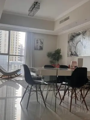 a dining room with a glass table and chairs at Prime Downtown 3 BDR-2 mn to Dubai Mall in Dubai