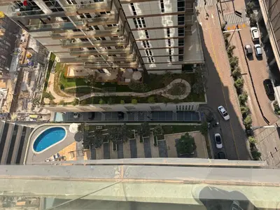 an overhead view of a city with a building at Prime Downtown 3 BDR-2 mn to Dubai Mall in Dubai