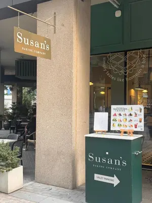 a store with a sign on the side of a building at Prime Downtown 3 BDR-2 mn to Dubai Mall in Dubai