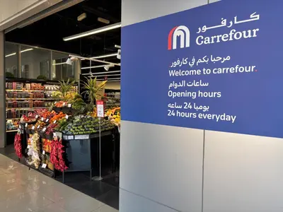 a store with a sign in a grocery store at Mama's Crib Dubai in Sabkhah