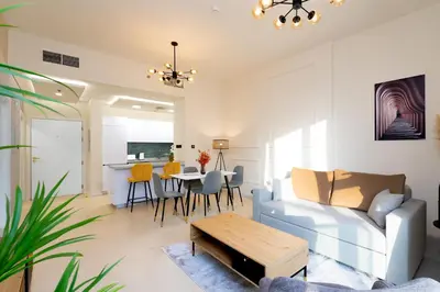 a living room with a couch and a table at Escape24 Chic 1BR in Al Furjan near Metro in Dubai