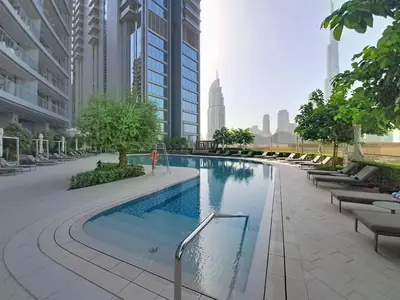 a swimming pool in a city with tall buildings at Vacationer l 2 Bed Direct Dubai Mall Access l Free Pool, Gym in Dubai