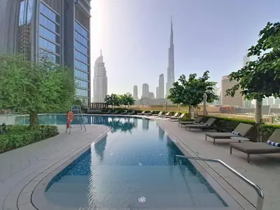 a swimming pool in a city with tall buildings at Vacationer l 2 Bed Direct Dubai Mall Access l Free Pool, Gym in Dubai