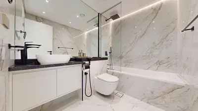 a bathroom with a sink and a toilet and a tub at Vacationer l Upgraded Chic 2 Bed l Pool View l Free Pool, Gym Access in Dubai