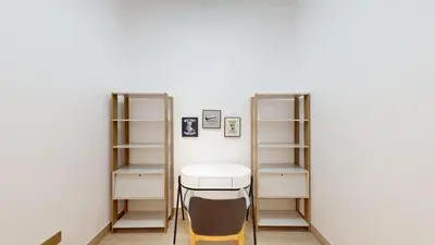 a room with shelves and a table and a stool at Vacationer l Upgraded Chic 2 Bed l Pool View l Free Pool, Gym Access in Dubai