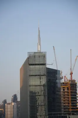 a tall building under construction with cranes at Joyful Journeys Downtown And Burj View Residence Business Bay One-Bedroom Apartment in Dubai