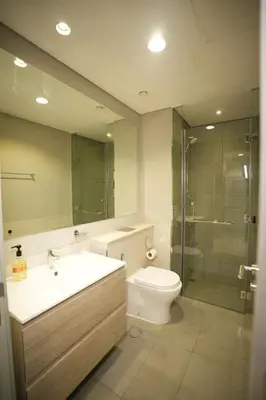 a bathroom with a sink and a toilet and a shower at Joyful Journeys Downtown And Burj View Residence Business Bay One-Bedroom Apartment in Dubai