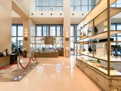 a lobby of a building with a lot of windows at 1BR Apt Kempinski Central Avenue Downtown Dubai in Dubai
