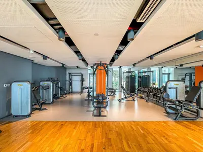 a gym with a bunch of treadmills and machines at Mira Holiday Homes - Sky High Bliss at Bluewaters Residence 3 Ain View in Dubai