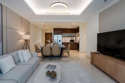 a living room with a couch and a table at Palace Beach Residence 2, Emaar Beachfront - Mint Stay in Dubai