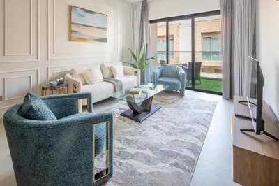 a living room with a couch and a table at A981 - kasturba Apt gandhi road in Dubai