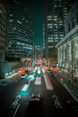 a city street at night with cars and buildings at A981 - kasturba Apt gandhi road in Dubai