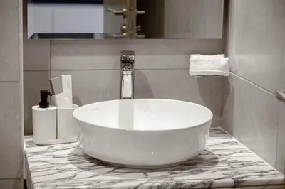 a bathroom with a large white tub on a counter at Dubai Business Bay Luxurious Studio with Canal View and access to Lagoon Pool in Dubai
