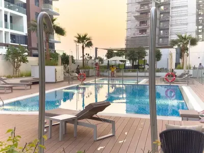 an image of a swimming pool in a building at Meydan Luxury Stylish 2BR with Pool & City Views in Dubai