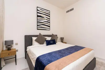 a bedroom with a large bed in a room at CitiHome Luxury Stay Panoramic Sea Views 2BR in Dubai