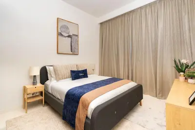 a bedroom with a large bed in a room at CitiHome Luxury Stay Panoramic Sea Views 2BR in Dubai