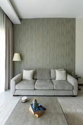 a living room with a couch and a table at 1BR with Burj Khalifa view in Business Bay in Dubai