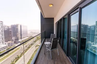 a balcony with a view of a city at 1BR with Burj Khalifa view in Business Bay in Dubai