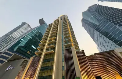 a group of tall buildings in a city at Balcony with Panoramic Dubai Water Canal and City Views, Walking Distance to Metro and Marine Transport, Urban Oasis, Business Bay by Deluxe Holiday Homes in Dubai