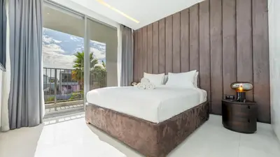 a bedroom with a large bed and a large window at Premium Sidra Villa with Private Pool and Exclusive Stay in Dubai