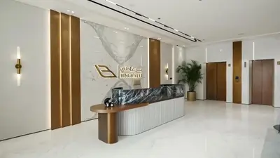 a lobby with a reception desk in a building at PVH - Binghatti Lavender - Tranquil Modern 1BR - Near JVC Community Park in Dubai