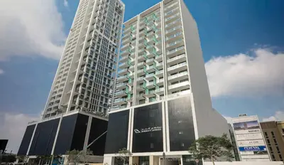 a tall white building with a sky at PVH - Binghatti Lavender - Tranquil Modern 1BR - Near JVC Community Park in Dubai