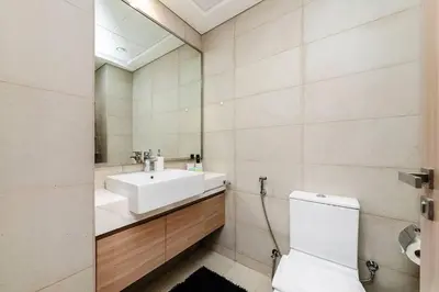 a bathroom with a sink and a toilet at Stylish Studio in Nad Al Sheba in Dubai