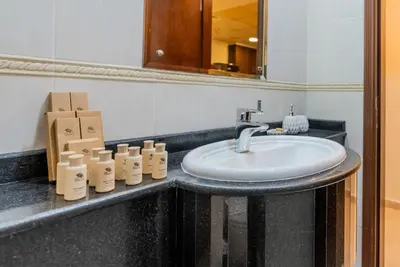 a bathroom with a sink and a mirror at TRPS - Elite Residence, Dubai Marina - Modern High-Rise, Near Popular Sites, Partial Sea View in Dubai