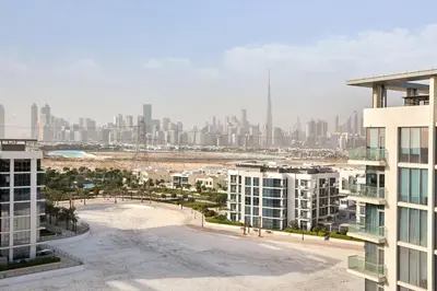an aerial view of a city with tall buildings at Newly Furnished Apt in District 1 in Dubai