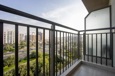 a balcony with a view of a city at 2BR in Safi Balcony Walk to Town Sq Park in Dubai