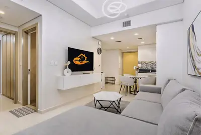 a living room with a couch and a table at Modern Luxury Stylish 2BR Near Downtown in Dubai