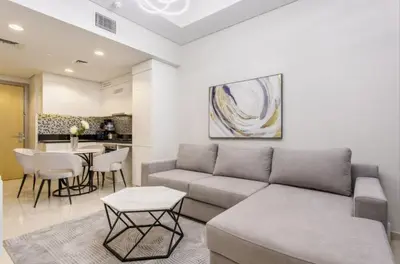 a living room with a couch and a table at Modern Luxury Stylish 2BR Near Downtown in Dubai