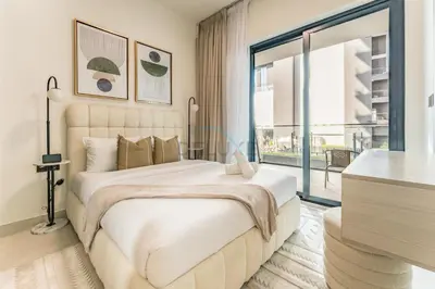 a bedroom with a large bed and a large window at Spacious Balcony Overlooking the Burj Khalifa and City Skyline, Near Bus Station, Quick Drive from Downtown Top Attractions, Binghatti Canal, Business Bay by Deluxe Holiday Homes in Dubai