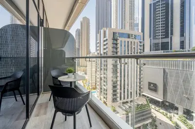 a balcony with a table and chairs and a city at GuestReady - Stylish retreat near Dubai Mall in Dubai