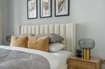 a bedroom with a bed with pillows on it at GuestReady - Stylish retreat near Dubai Mall in Dubai