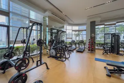 a gym with treadmills and exercise equipment in a building at GuestReady - Stylish retreat near Dubai Mall in Dubai