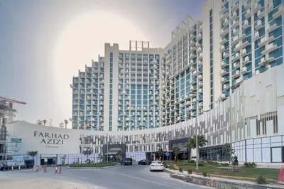 a large building with a parking lot in front of it at GuestReady - Sunny Retreat near Dubai Frame in Dubai