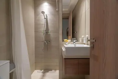 a bathroom with a sink and a shower at GuestReady - Contemporary elegance in Dubai in Dubai