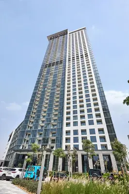a tall building with cars parked in front of it at STAY BY LATINEM Luxury 1BR Holiday Home CVG 604 Near Downtown in Dubai