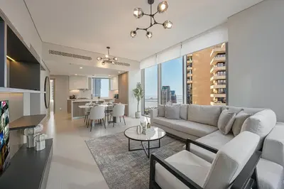 a living room with a couch and a table at Daniels 2BR at Liv Marina with Marina View in Dubai