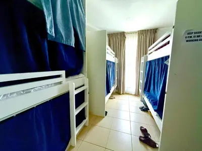a room with blue bunk beds in a hospital at WAHA WOW Bed space Available in Luxury Apartment in Sabkhah
