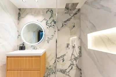 a bathroom with a sink and a mirror at PVH - Iconic Waterfront Escape - Luxury 2BR with Sea Views - DUBAI MARINA in Dubai