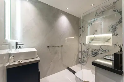 a bathroom with a shower and a sink and a toilet at PVH - Iconic Waterfront Escape - Luxury 2BR with Sea Views - DUBAI MARINA in Dubai