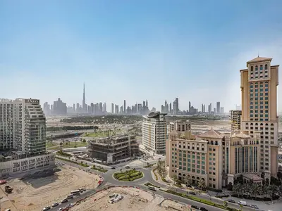an aerial view of a city with tall buildings at Livin' Holidays - 2BR - Skyline View with Burj Glimpse in Dubai