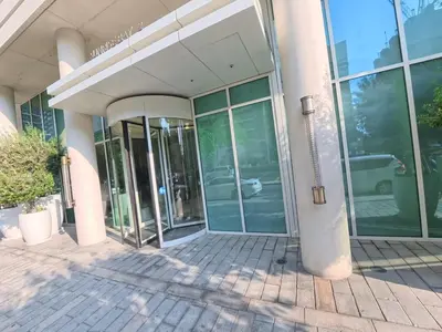 an entrance to a building with glass doors at Orange Plumeria 1701 - 2BR SeaView with Prvt Beach in Dubai