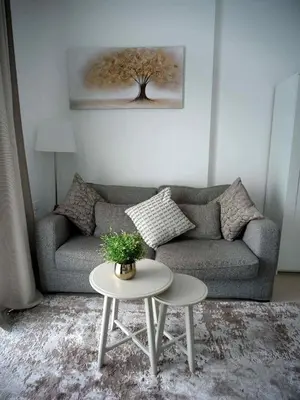 a living room with a couch and a table at Sunsand Studio at Dubai Marina in Dubai