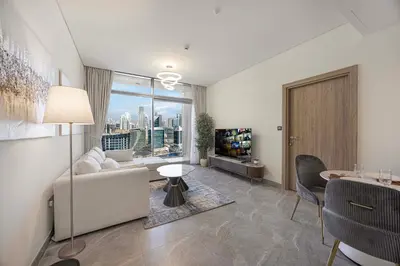 a living room with a couch and a table at LUX 1 BDR apartment Downtown - Burj Khalifa view in Dubai